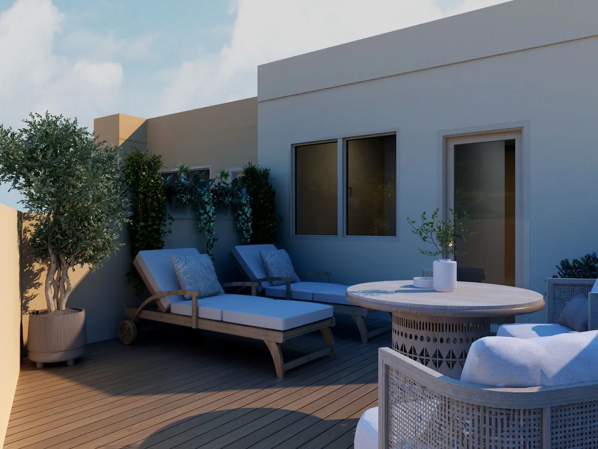 Terraza privada con tumbonas, mesa redonda y olivos en maceta